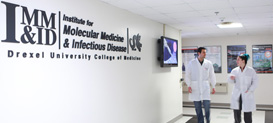 Students walking down the hall at the Institute for Molecular Medicine and Infectious Disease at Drexel University College of Medicine.