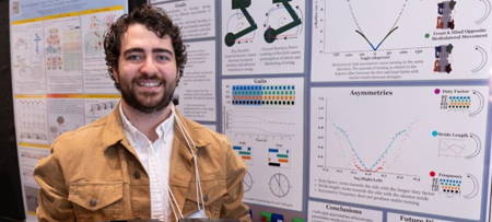 Drexel graduate student working in a biomedical research lab, standing next to laboratory equipment.