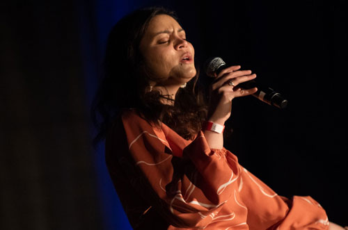 A student singing at the 2020 Pediatric AIDS Benefit Concert