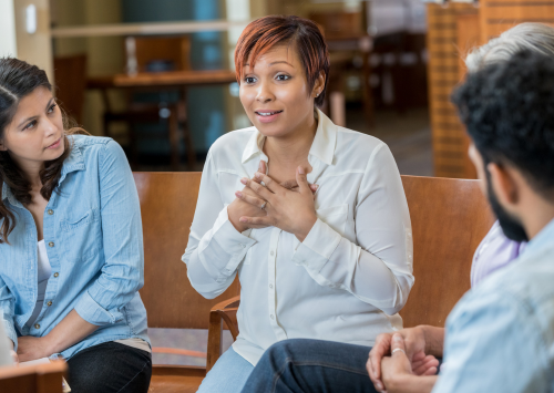 Woman speaking in support group