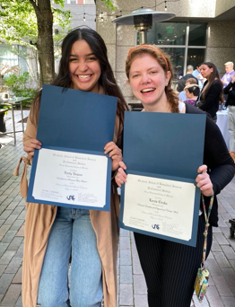 Emily Esquea and Lorela Ciraku celebrating their awards in research excellence.