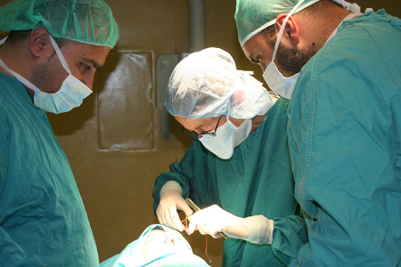 On a trip to Israel, Libby Wilson (center) worked with surgeons who perform cleft palate surgery on the West Bank.