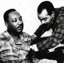 Walter Lomax, MD '57, treats Dr. Martin Luther King Jr. for a viral infection.