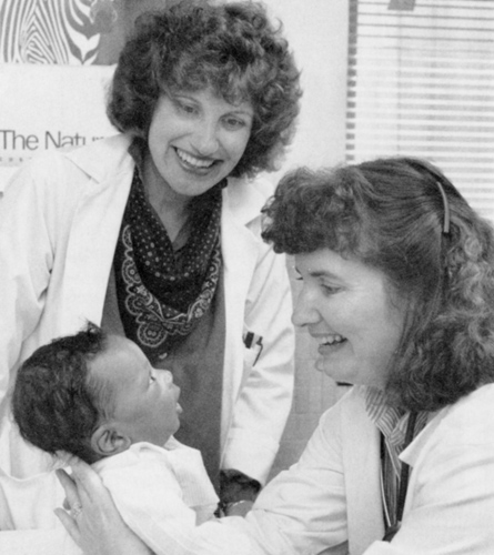 Trude Haecker, MD, MCP ’80, (left) and nurse practitioner Martha Cockerill check on a baby in the Caring Together program.