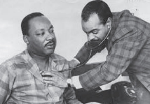 Hahnemann alumnus Walter P. Lomax, MD ’57, treats Martin Luther King Jr. for laryngitis.