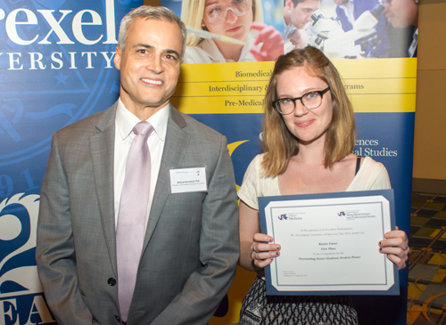 Michael Bouchard, PhD, director of the Division of Biomedical Science Programs, presented the award for outstanding poster by a senior graduate student to Kaitlin Farrell, an MD/PhD candidate in the neuroscience program, for 'Chronic Inflammation and Depression After Spinal Cord Injury.'