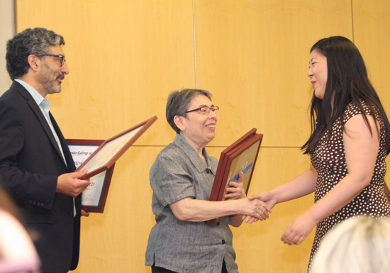 Drs. Steven Rosenzweig and Florence Gelo present a certificate of recognition from the Humanities Scholars program to Clarissa Chu.
