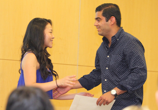 Diane Sun presents the Student Government Association Award to Sameer Massand.