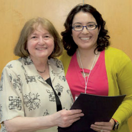 Ellie Cantor, PhD, MCP '79, presents Vanessa Durand, DO, with her fellowship award letter