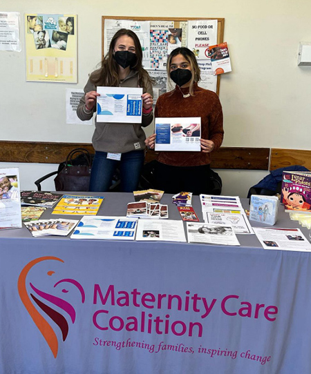 First-year MD students Jennie Reisman and Ifrah Malik volunteering at an information table at Philadelphia’s Health Center 5.