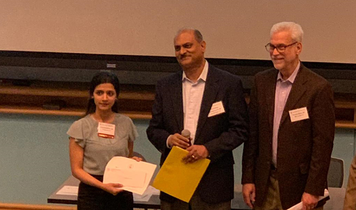 Dr. Rajalakshmi accepting her award, 2019 Colloquium of Scholars