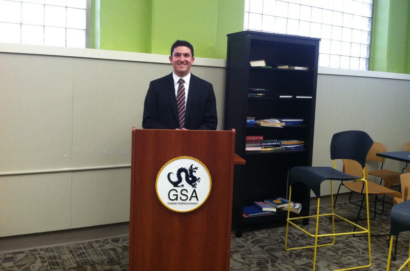Nick Thompson, president of the Graduate Student Association, stands in the graduate student lounge he hopes to renovate.