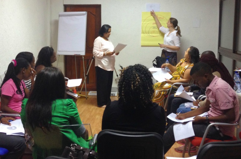  Suruchi Sood and Amy Henderson Riley training employees in Mozambique.