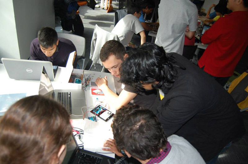 One of the teams working on their project during the 24-hour hackathon in the ExCITe Center.