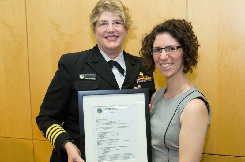 Allison Gutierrez, right, receives the United States Public Health Service Excellence in Public Health Award from Capt. JoAnne Hitte, an officer in the Commissioned Corps USPHS, on behalf of the Surgeon General of the United States. 