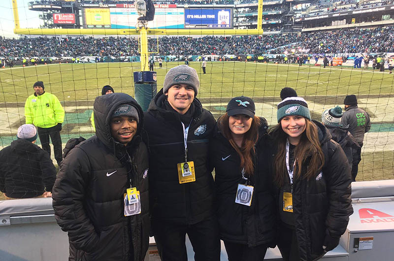 Jawan Hunter, left, was a corporate sponsorship sales and service co-op with the Eagles, and he cheered on the team at the Super Bowl.