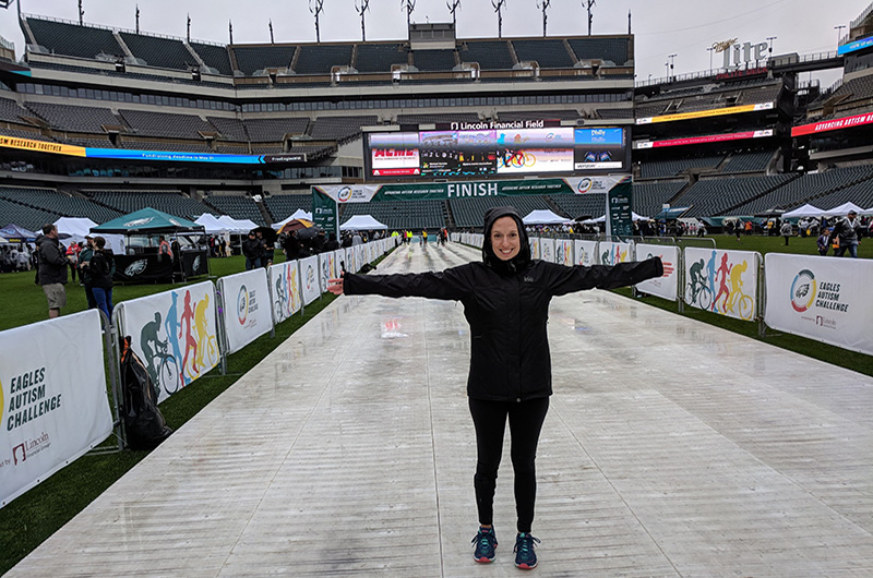 Assistant Project Director of Transition Pathways in the A.J. Drexel Autism Institute Jackie Abrams stands before the finish line inside Lincoln Financial Field at the 2018 Eagles Autism Challenge.