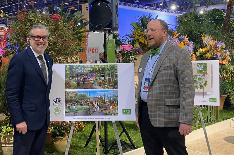 Drexel University President John Fry (left) and Pennsylvania Horticultural Society President Matt Rader look at renderings of "The Gateway Garden at Drexel."