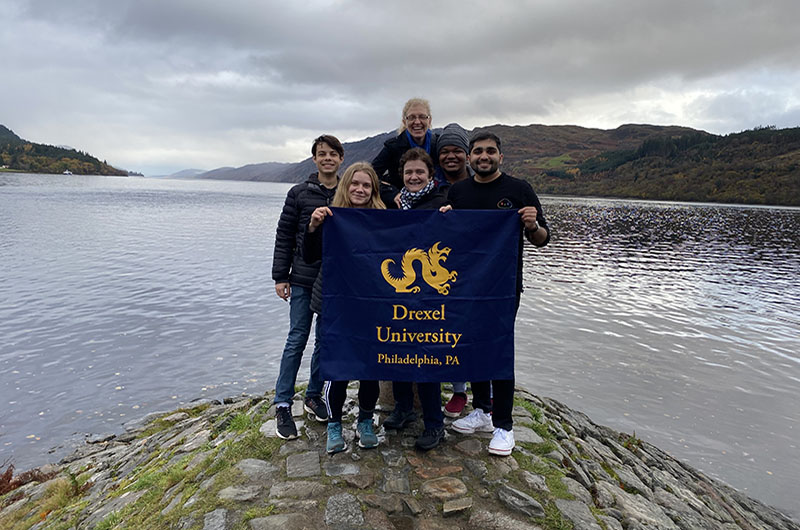 The Drexel delegation for the second week of COP26 at Loch Ness. From left to right: William Newman, Sarah Wetxel, School of Education EdD candidate Anita Forrester, Kristy Kelly (behind Forrester), Niyi Onanuga and Atharva Bhagwat. Photo courtesy Atharva Bhagwat.