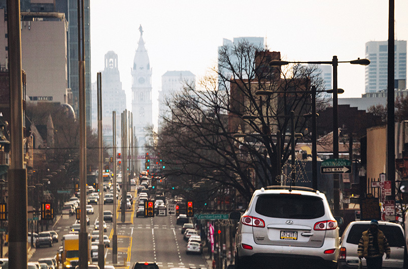 Evening traffic on the streets of Philadelphia. Downtown and City Hall in background.