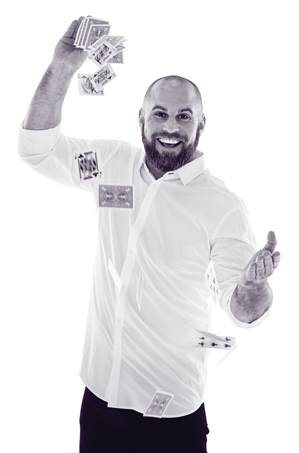 NFL player holding cards.