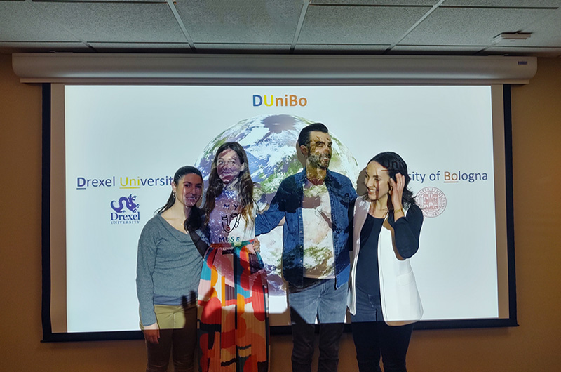 People in front of a PowerPoint