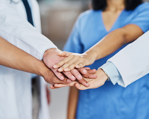 Medical team hands together