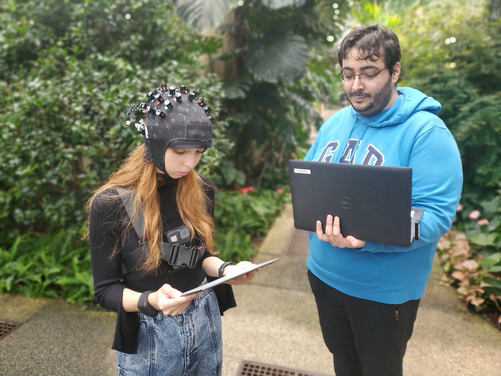 Yigit Topoglu and a colleague using fNIRS, a brain monitoring device.