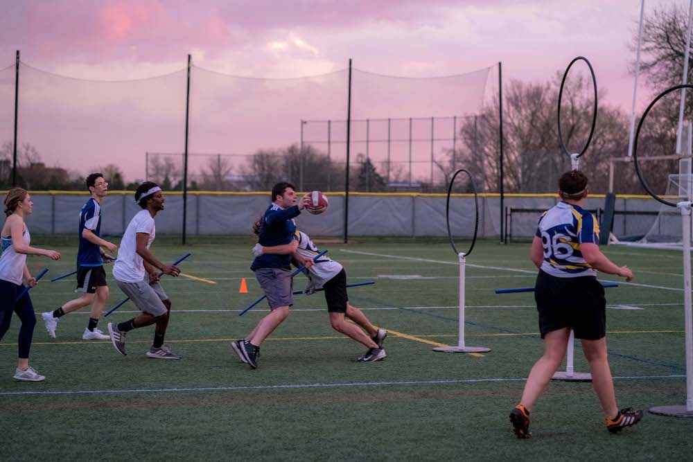 Students playing Quidditch