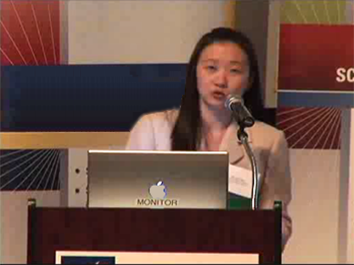 Dr. Lee speaking at podium