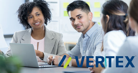 Group of professionals sitting and working together, Vertex logo in lower right corner 