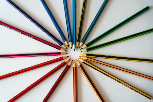 Image of colored pencils in a circle, forming a heart