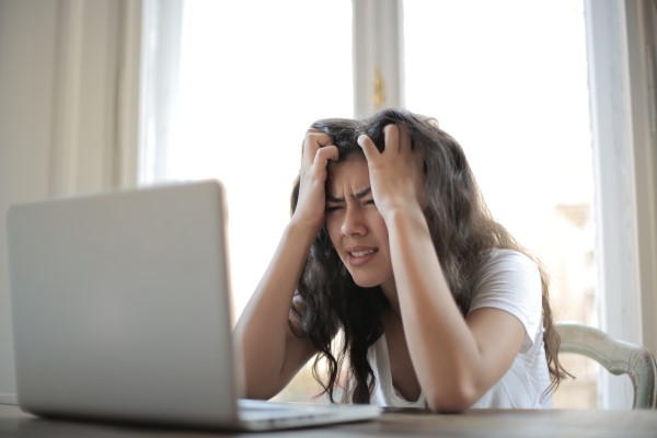 Stressed student in front of computer