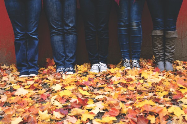 Photo of people standing on leaves