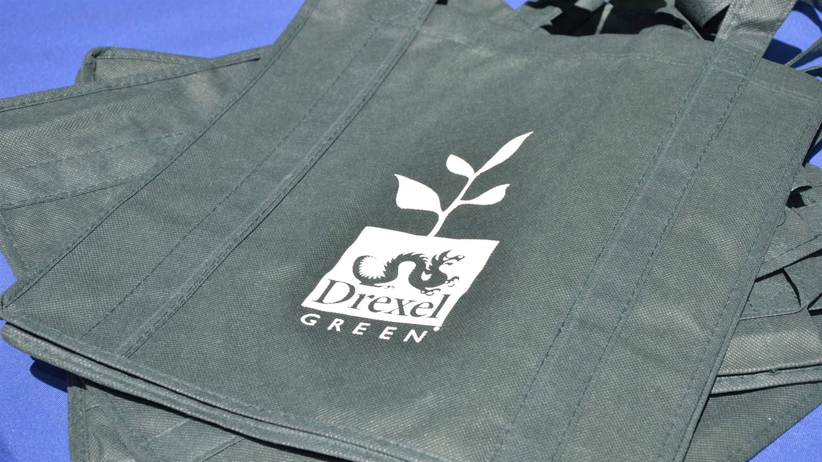 Green reusable bag reading Drexel Green