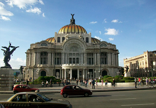 Cars driving by the Palacio de Bellas Artes (Palace of Fine Arts) in Mexico City, Mexico