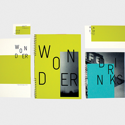 Taylor Murphy's Wonder restaurant design with menus in lime green, black and white photo of a cafe sign, white, and teal
