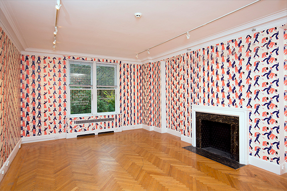 'Above the Sounds of Ideologies Clashing' by Nick Cassway, a room encassed in a bright and bold wallpaper design.