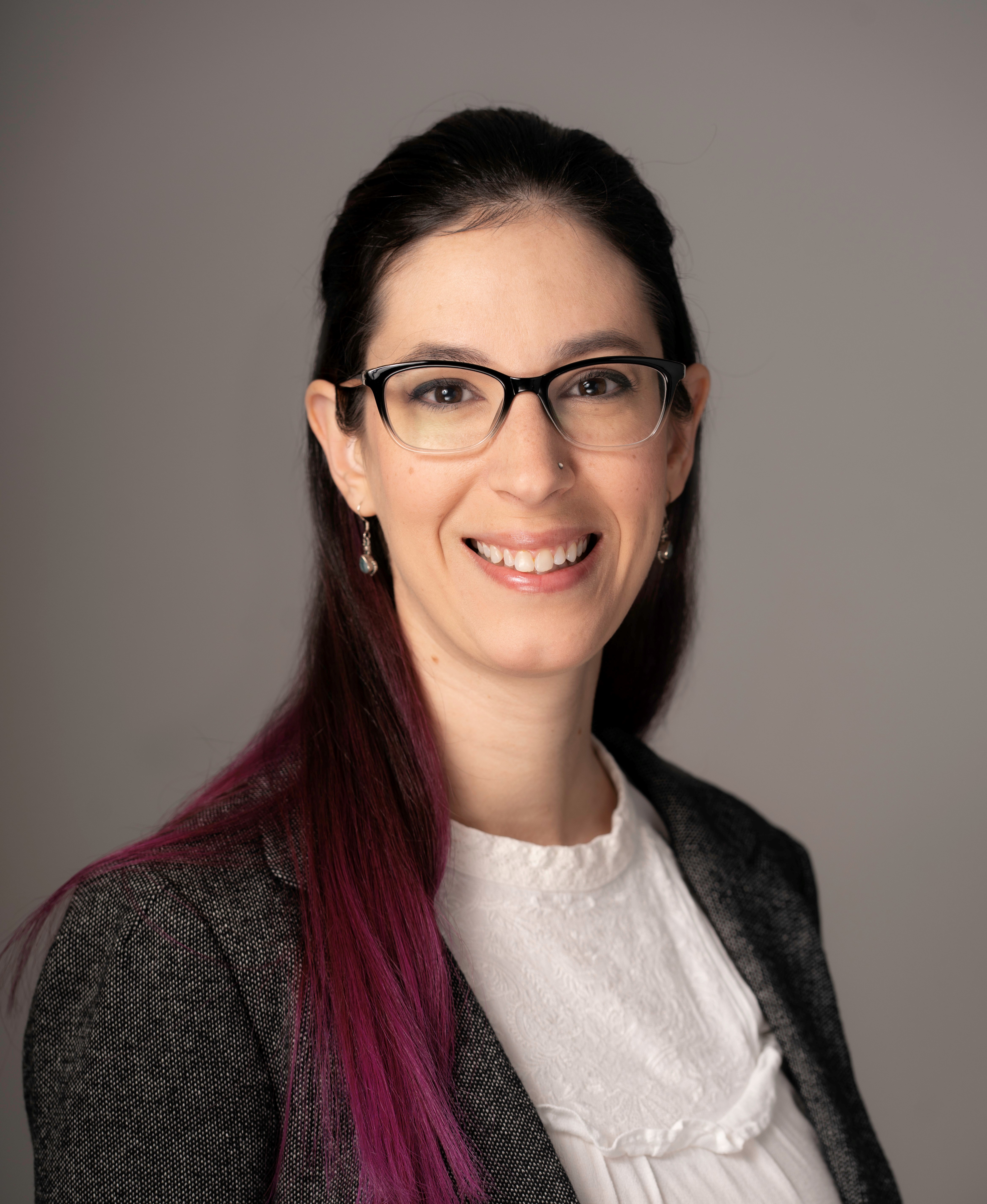 headshot of woman in glasses
