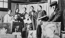 Old Black and White photograph of artists with paintings