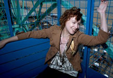 Photograph of Caithlin De Marrais on a blue ferris Wheel