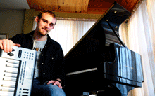 Image of Matt Campana with a piano in the background