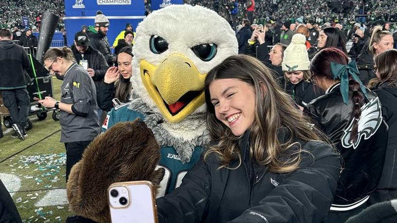 Rhian Johnson at the NFC Championship football game with Swoop the mascot