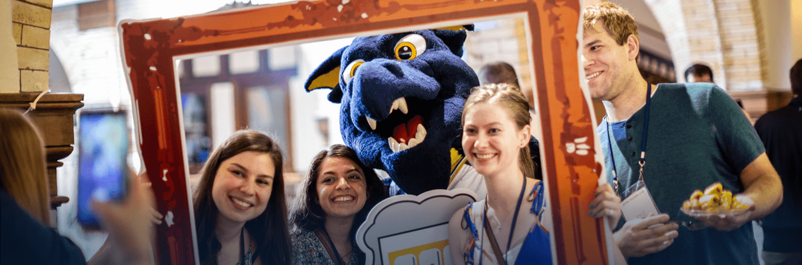 alumni with mario the dragon